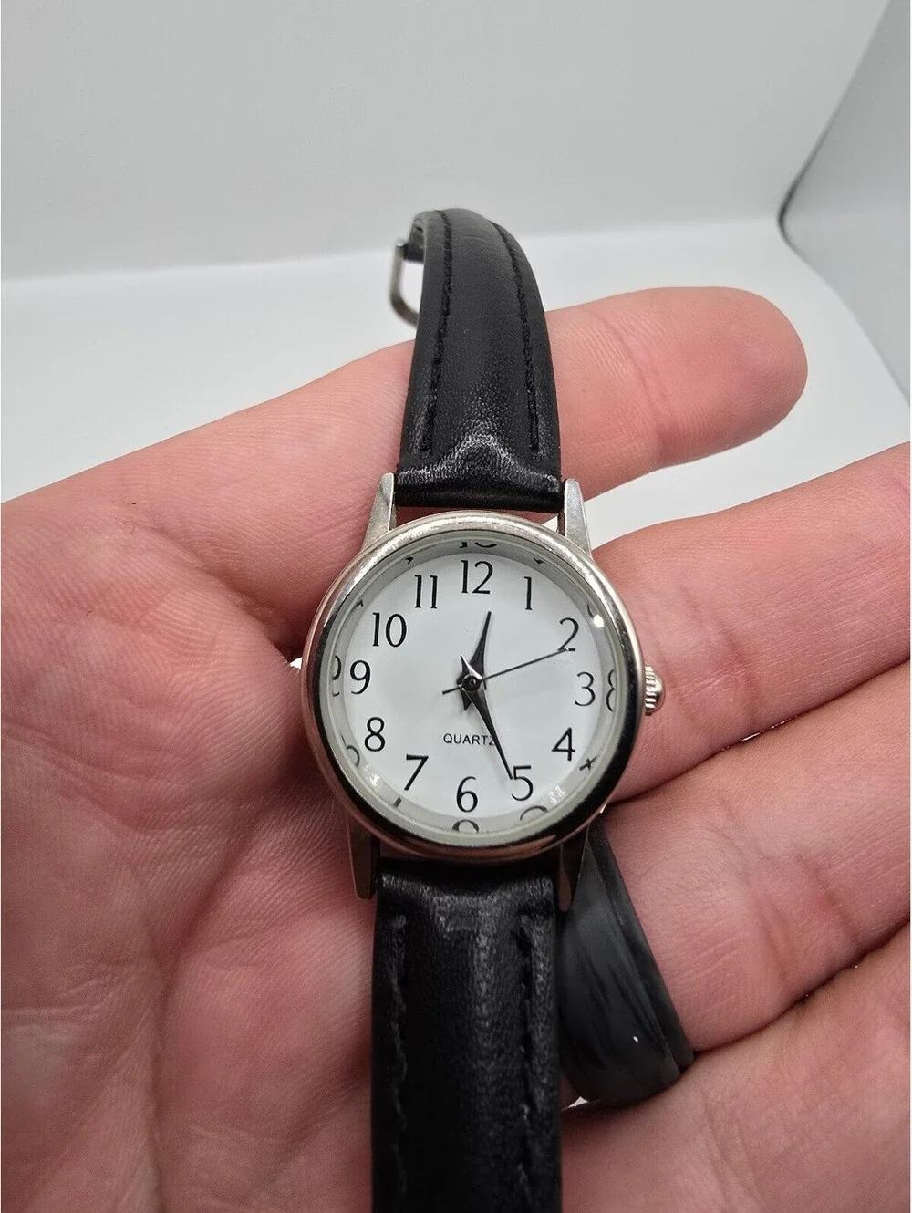 Accutime Quartz Analog Wristwatch White Dial Arabic Numerals Silver Case 26mm